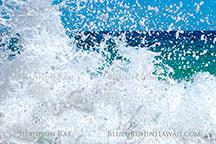 Ocean splash up close with beautiful detail of the droplets against the blue hawaii ocean